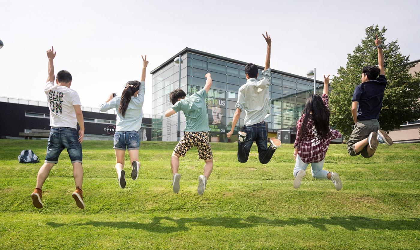Students jumping at VUB Main Campus